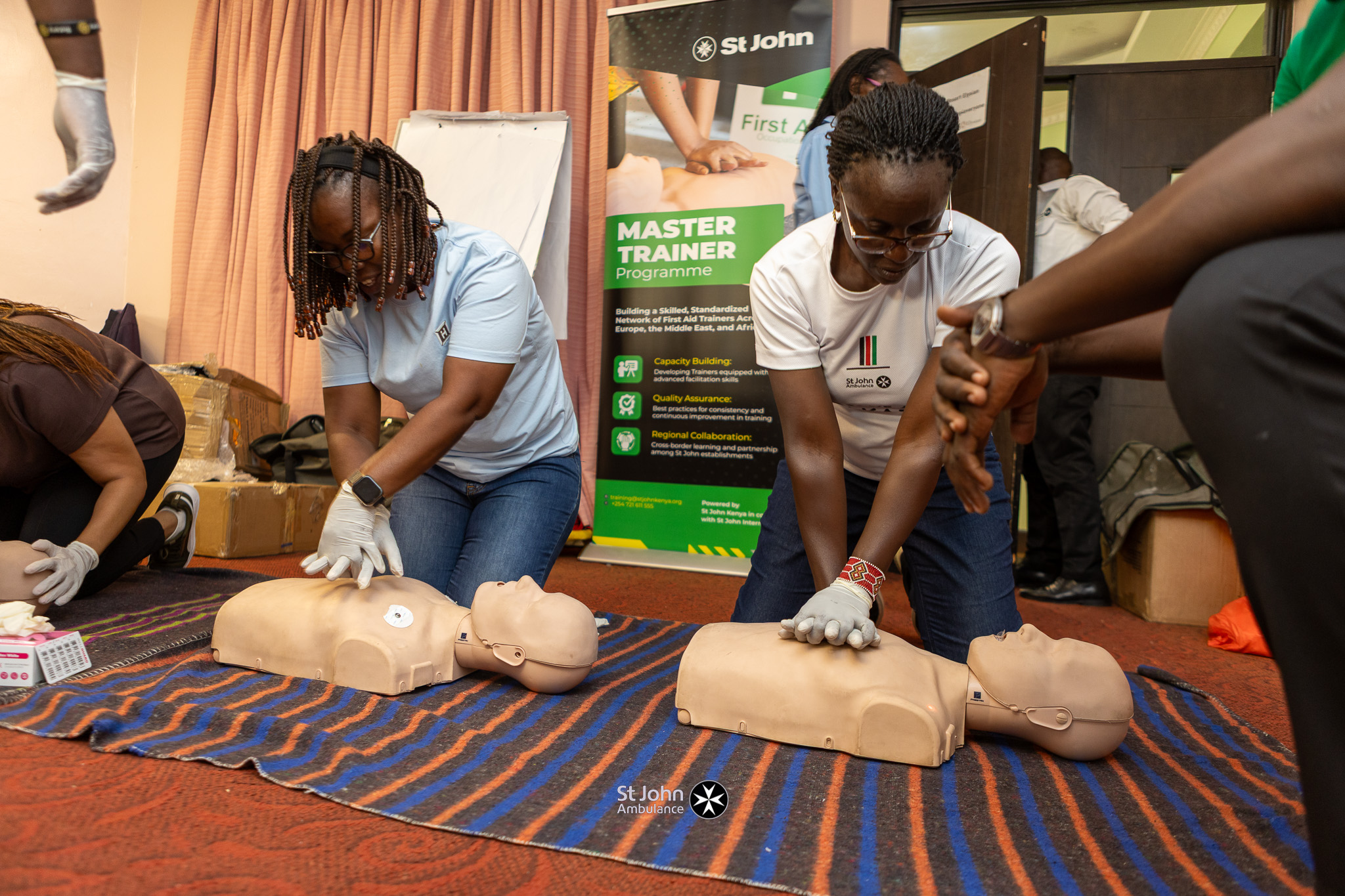 St John Ambulance Kenya trainers demonstrating lifesaving CPR skills